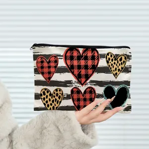 Canvas cosmetic pouch with cute heart prints, zipper makeup bag for women and girls daily use.
