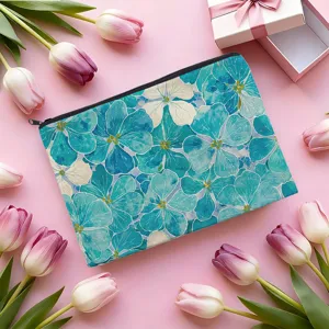 Blue floral print cosmetic bag detail, portable zipper pouch for travel makeup and stationery.