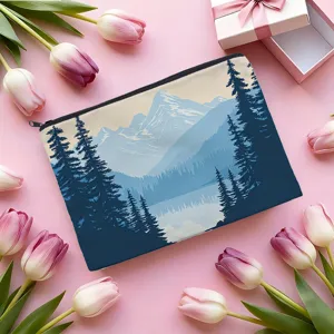 Detail view of the canvas cosmetic bag featuring a scenic mountain landscape and black zipper.