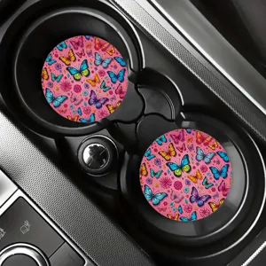 Close-up scene of colorful butterfly pattern car cup coasters placed inside the center console.