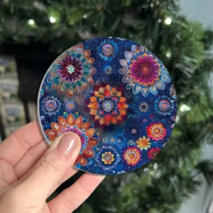 Round ceramic absorbent coffee cup mat with vibrant mandala floral pattern for table protection