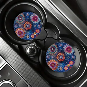 Detailed view of vibrant blue floral mandala car cup coasters placed neatly in vehicle holders.