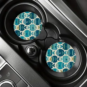 Detail shot of blue retro fish pattern car cup coasters, absorbent surface for auto interior.