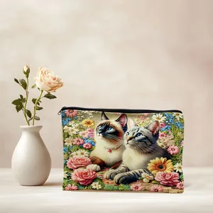Canvas cosmetic bag featuring cute cats and floral print, zipper pouch for makeup storage.