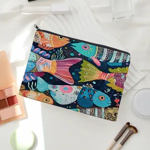 Detailed view of canvas cosmetic bag with vibrant colorful fish art pattern, zipper closure.