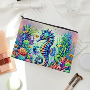 Canvas makeup pouch featuring vibrant seahorse coral print, ideal for daily cosmetic storage.