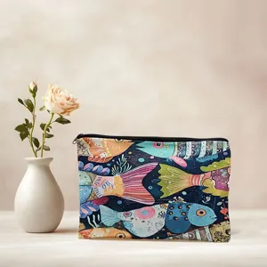 Canvas cosmetic bag with colorful abstract fish print, ideal makeup storage pouch.