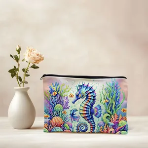 Canvas cosmetic pouch featuring vibrant seahorse and coral reef print for daily organization.