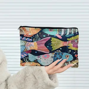 Artistic colorful fish pattern canvas cosmetic bag detail showing zipper and fabric texture close-up