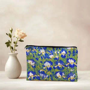 Detailed view of the blue floral canvas zipper pouch, perfect for makeup and stationery.