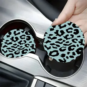 Close-up detail of blue leopard print silicone car cup coaster, anti-slip interior decor.