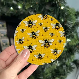 Sottobicchiere rotondo in silicone con motivo di api gialle per tazza, antiscivolo e resistente.