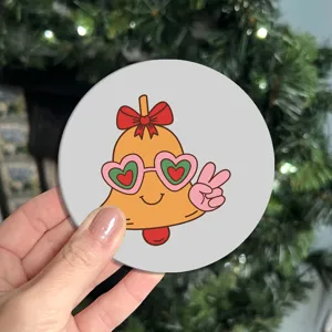 Close-up of cute cartoon bell car coaster detail showing non-slip rubber material.