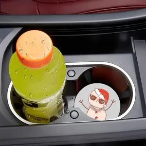 Car cup holder coaster detail showing non-slip silicone pad with cute cartoon design in vehicle.