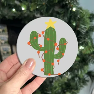Close-up view of a cute cartoon Christmas cactus car coaster, non-slip cup holder mat detail.