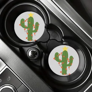 Close-up of cute Christmas cactus car coasters displayed neatly in a vehicle cup holder.