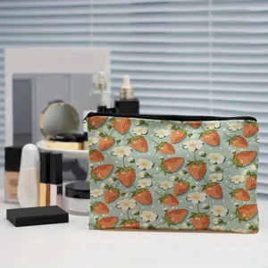 Cute strawberry print makeup bag portable zipper toiletry pouch for women travel storage.