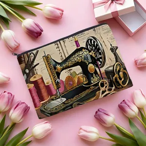 Detail view of the vintage sewing machine pattern on this durable canvas cosmetic pouch.