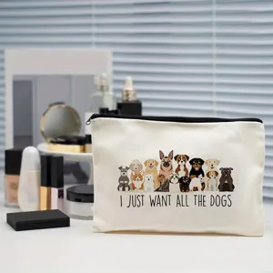 Detailansicht der weißen Kosmetiktasche aus Leinen mit süßen Hunde-Illustrationen und Spruch.