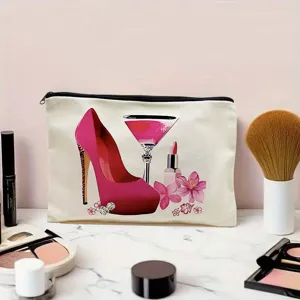Detailed shot of canvas makeup bag featuring chic high heel and cosmetic print design on desk.
