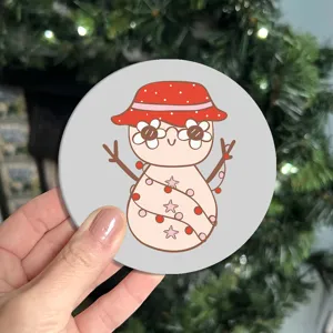 Cute cartoon snowman pattern car anti-slip water cup coaster, durable coffee cup mat detail.