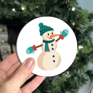 Cute cartoon snowman printed car coaster, anti-slip cup holder mat for auto interior decor.
