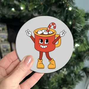 Detailed shot of a round car coaster featuring a cute cartoon cup design with non-slip soft rubber.