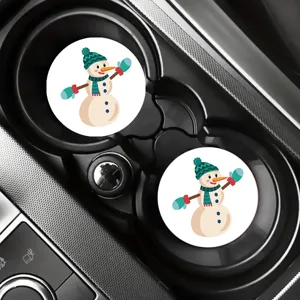 Close-up view of cute cartoon snowman car cup coasters placed inside center console.