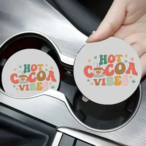 Detailed view of the round car cup coaster featuring cute hot cocoa vibes design in cup holder.