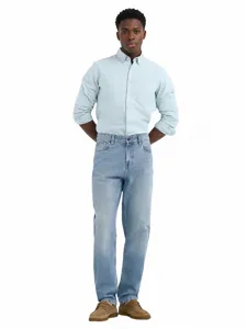 Detailed full view of men's loose straight fit jeans paired with a casual button-down shirt.