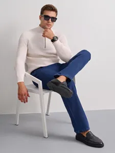 Men's straight jeans detail view showcasing comfortable fit and classic dark blue denim fabric texture.