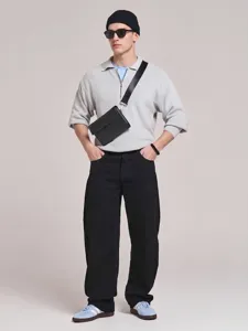 Detailed view of stylish casual loose straight-fit black denim trousers for men.
