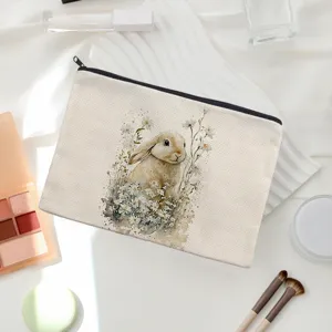 Linen makeup pouch with watercolor bunny and daisy design, ideal for daily storage.