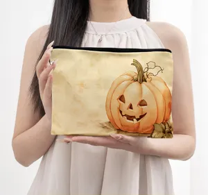 Leinen Kosmetiktasche mit festlichem Halloween Kürbis Print, tragbar und praktisch für die Reise.