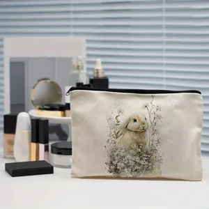 Linen cosmetic bag featuring a cute watercolor bunny and floral print with zipper closure.