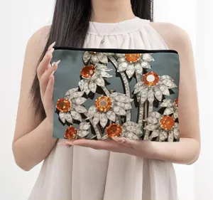 Canvas zipper pouch featuring elegant diamond and orange floral print, perfect cosmetic bag.