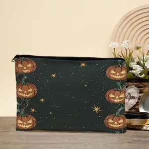 Detail view of Halloween pumpkin print cosmetic bag, dark zipper pouch with starry night.