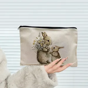 Linen makeup bag with cute watercolor bunny and floral print, perfect for Easter and daily storage.