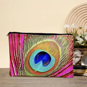 Gedetailleerd overzicht van het canvas cosmetische tasje met pauwenveer print en zwarte rits.