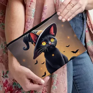 Detailed view of the black cat print zipper makeup bag featuring a cute witch hat design.