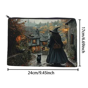 Close-up detail of the vintage witch and cat pattern linen cosmetic pouch with black zipper.