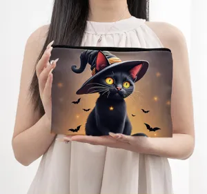 Detail view of a black cat Halloween witch hat cosmetic pouch, zipper closure, portable.