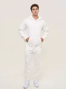 Detail view of the plain white hoodie and sweatpants set worn by a model, clean and stylish.