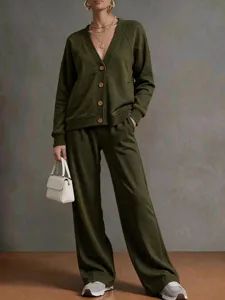 Detailed view of casual olive green V-neck knit cardigan and wide-leg trousers outfit.