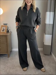 Detail view of casual half-zip sweatshirt and wide-leg trousers loungewear set.