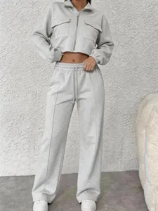 Light grey two piece tracksuit crop zip jacket and high waist wide leg pants casual set.