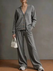 Detailed view of women's autumn winter solid color V-neck cardigan and loose wide leg pants set.