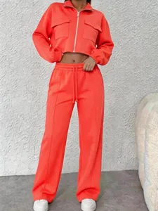 Orange zip-up cropped jacket and high-waist wide leg pants casual two piece set for women.