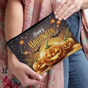 Halloween cosmetic bag detail featuring spooky pumpkin and bat print with secure zipper closure.