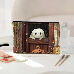Detailed view of the Halloween canvas cosmetic bag featuring cute ghost and pumpkin print.